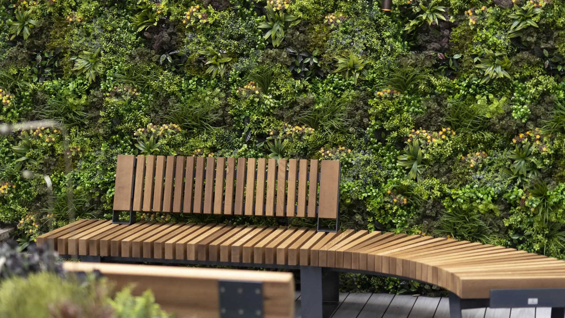 Elevate Your Space with On-Trend Artificial Green Walls and Black Panelling